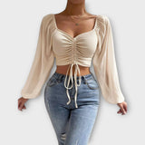Jacqueline – Blusa versátil que destaca tu estilo en la noche