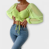 Jacqueline – Blusa versátil que destaca tu estilo en la noche